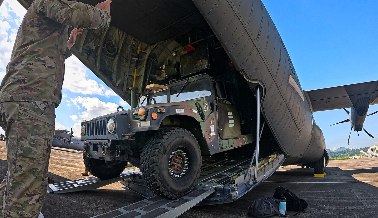 U.S. Army Soldiers and U.S. Air Force Airmen position a Platoon Operation Center (POC), assigned to 1st Multi-Domain Task Force, U.S. Army Pacific (USARPAC), into a C-130 Hercules assigned to 374th Airlift Wing, 5th Air Force during a HIMARS Rapid Infiltration (HIRAIN), training event in support of Salaknib 25 at Subic Bay, Philippines, May 22, 2025.