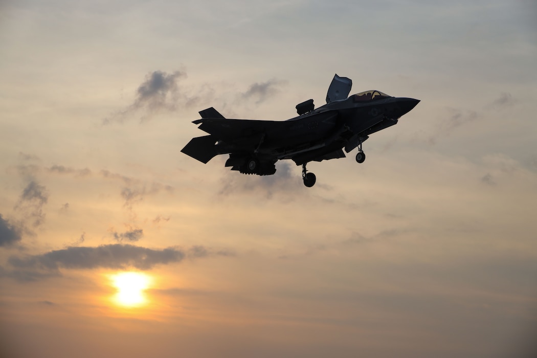 A U.S. Marine Corps F-35B lightning II aircraft assigned to Marine Fighter Attack Squadron (VMFA) 242, 31st Marine Expeditionary Unit, prepares to land during night flight operations aboard the amphibious assault ship USS America (LHA 6), in the Philippine Sea, May 31, 2025.