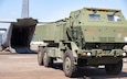 A High Mobility Artillery Rocket System (HIMARS), assigned to 1st Multi-Domain Task Force, U.S. Army Pacific (USARPAC), assumes the position for a line haul into a C-130 Hercules assigned to 374th Airlift Wing, 5th Air Force during a HIMARS Rapid Infiltration (HIRAIN), training event in support of Salaknib 25 at Subic Bay, Philippines, May 22, 2025.