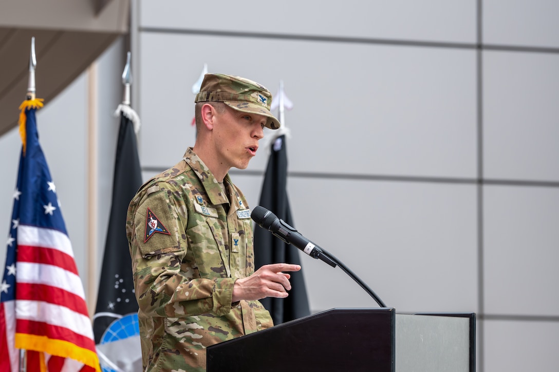 man in uniform speaking at podium