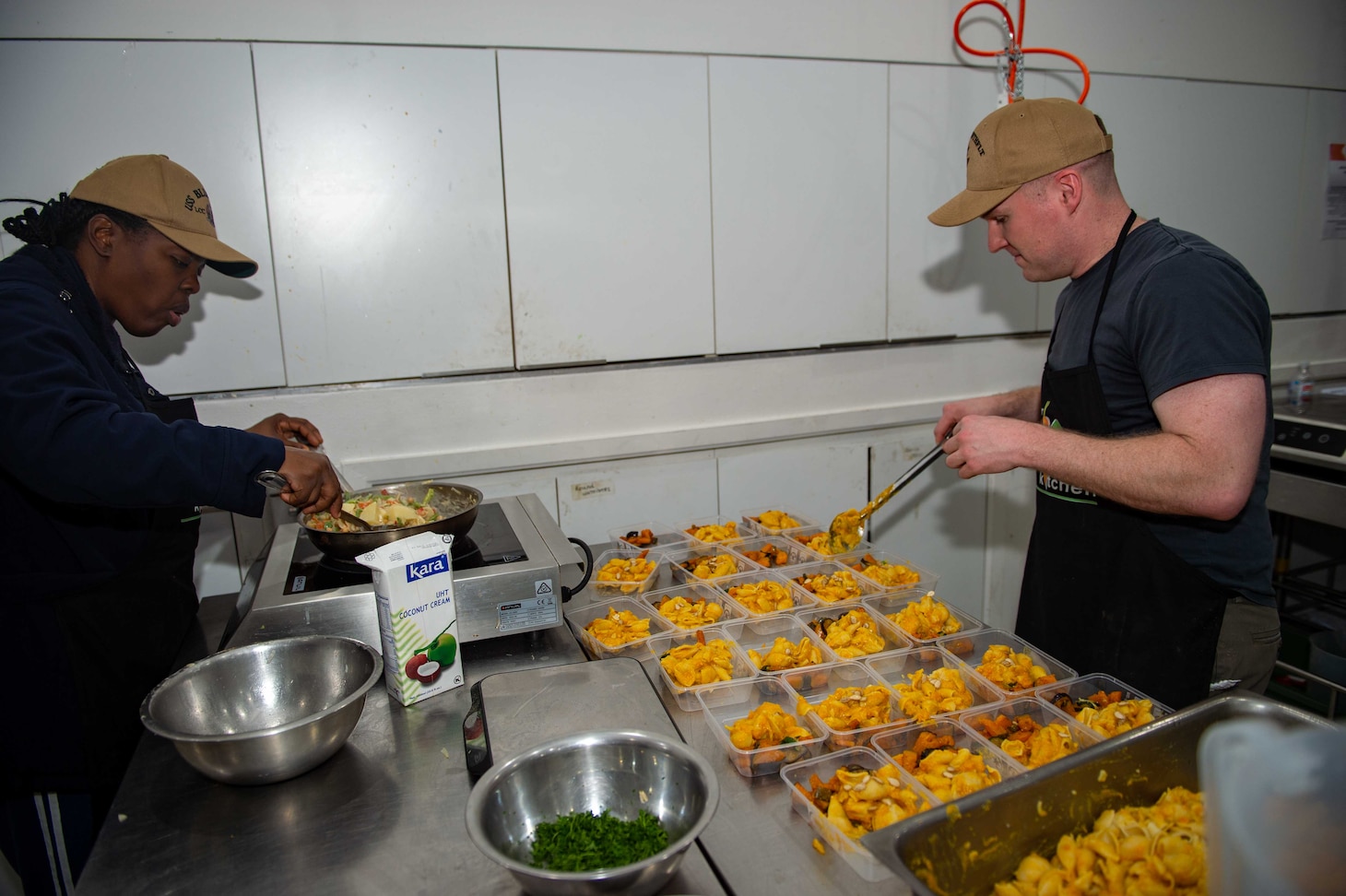 SYDNEY (May 28, 2025) – Sailors assigned to U.S. 7th Fleet and 7th Fleet flagship USS Blue Ridge (LCC 19) prepare food while volunteering with the nonprofit organization Our Big Kitchen during a scheduled port visit in Sydney, May 28, 2025. The Blue Ridge and embarked 7th Fleet staff conduct regular Indo-Pacific patrols to deter aggression, strengthen alliances and partnerships, and advance future warfighting capabilities. (U.S. Navy photo taken by Mass Communication Specialist Seaman Alajia Williams)