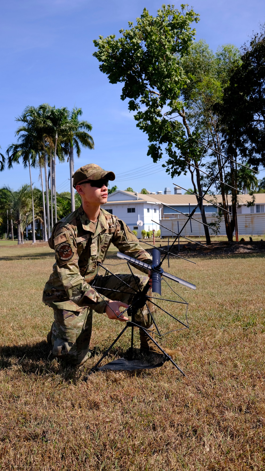 U.S. Air Force Senior Airman Christopher Koon, 18th Communications Squadron expeditionary communications technician, sets up radio communications during exercise RECCE-Edge 25 at Royal Australian Air Force Base Darwin, Australia, May 20, 2025.