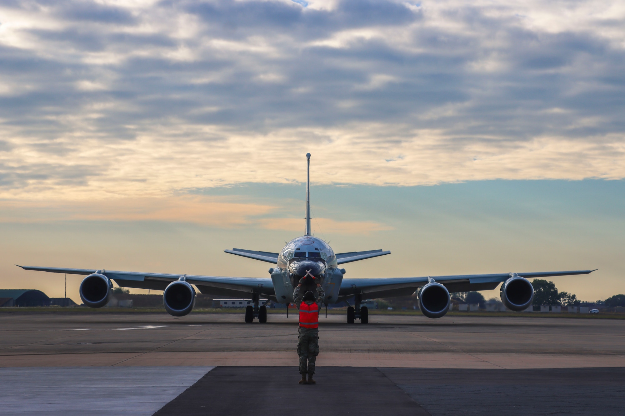 U.S. Air Force Airman 1st Class Malakhi Lee, 82nd Expeditionary Reconnaissance Squadron maintenance flight crew chief, marshals an RC-135V Rivet Joint during exercise RECCE-Edge 25 at Royal Australian Air Force Base Darwin.