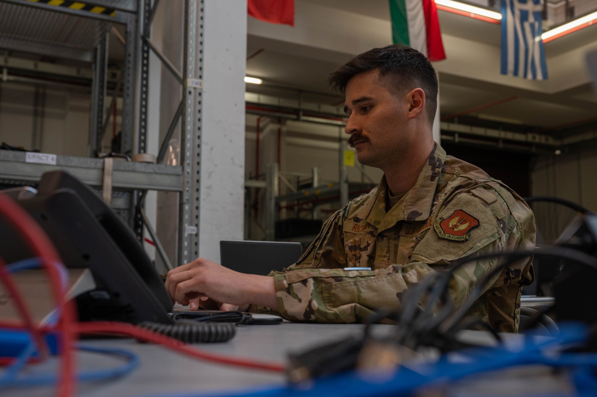 Warrant officer works in office.