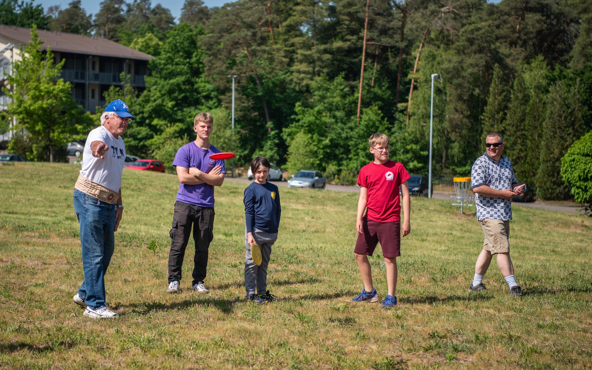 Boy Scouts of America members and sponsors of the Wayne Carlson Disc Golf Course play disc golf.