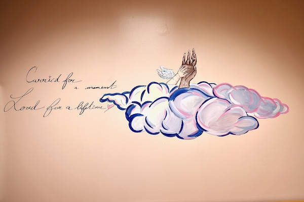 Murals and artwork painted by Hospitalman Lucia Carano add a meaningful and artistic touch to the revitalized Multi-Service Ward at Naval Hospital Twentynine Palms, which officially reopened during a ribbon-cutting ceremony on May 29. The artwork, themed around pregnancy and parenthood, was created to foster a comforting and supportive atmosphere for patients (U.S. Navy photo by Christopher C. Jones, NHTP/NMRTC Twentynine Palms public affairs officer).