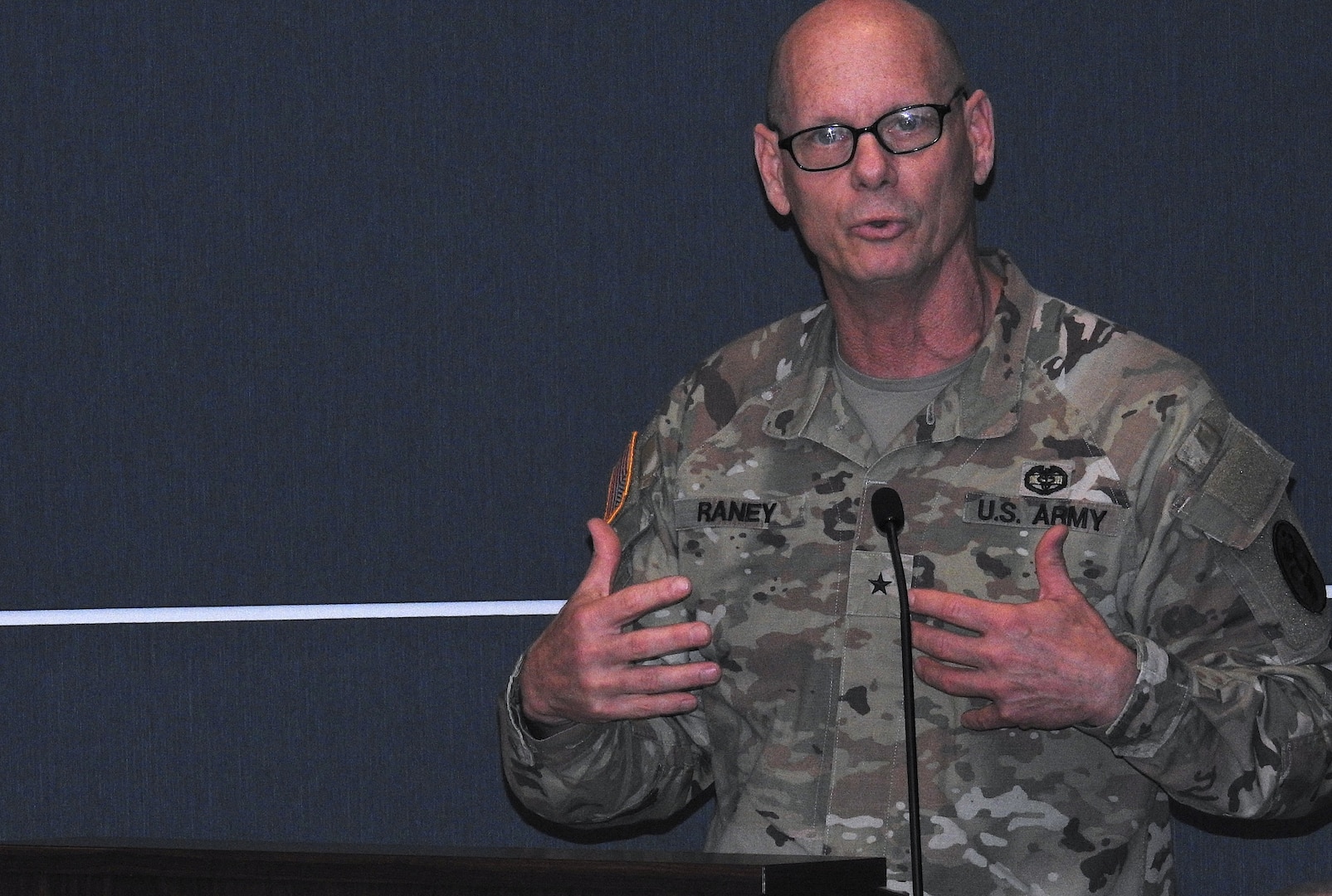 U.S. Army Brig. Gen. (Dr.) Lance Raney, Commanding General of Medical Readiness Command, East, serves as guest speaker during a recent luncheon saluting military caregivers at the USO on Naval Support Activity Bethesda, home to Walter Reed National Military Medical Center.