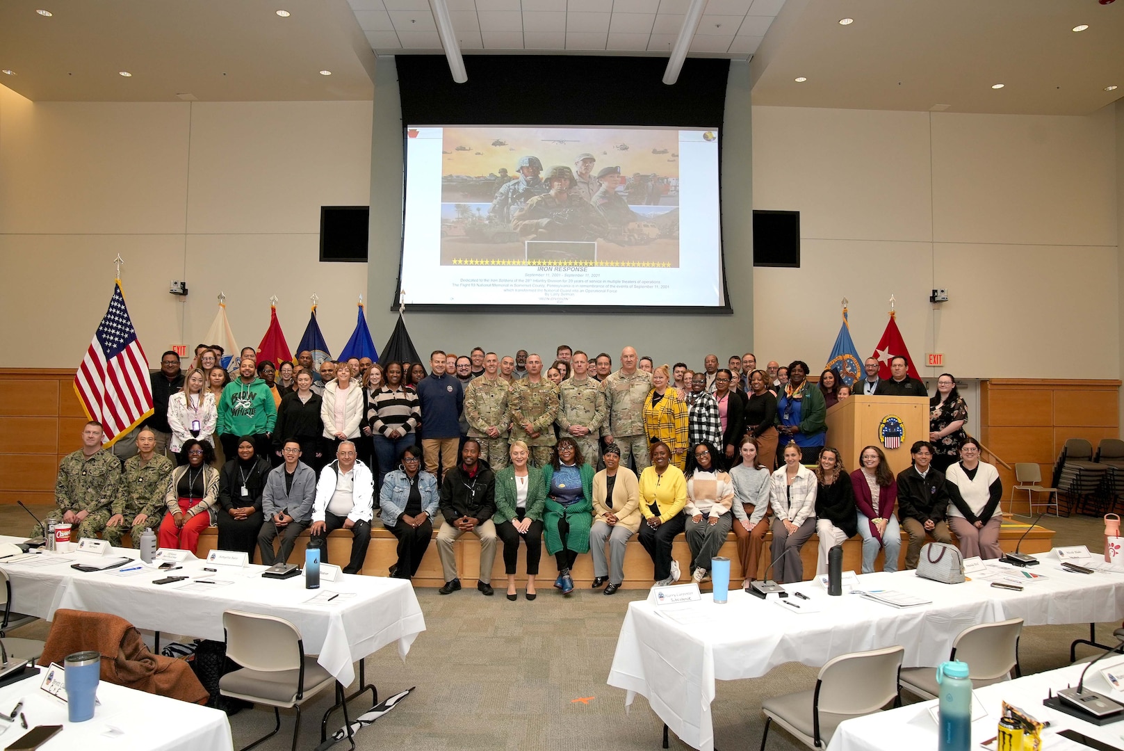 U.S. Army Commanding General of the 28th Infantry Division Maj. Gen. Michael Wegscheider and military cadre pose with Defense Logistics Agency Troop Support Academy attendees after speaking with them May 21.