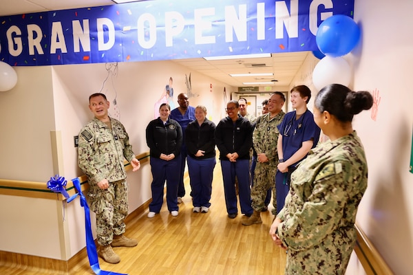 Capt. Daniel Clark (left), commanding officer of Naval Hospital Twentynine Palms, and Cmdr. Christine Higgins (right), Maternal-Infant Nursing Department head and staff certified nurse midwife, discuss improvements after cutting the ribbon during a ceremony on May 29 marking the relocation and revitalization of the hospital’s Multi-Service Ward. The upgraded space, which houses the Maternal Infant Nursing Department (MIND), enhances inpatient care for military families aboard the Marine Corps Air Ground Combat Center (U.S. Navy photo by Christopher C. Jones, NHTP/NMRTC Twentynine Palms public affairs officer).