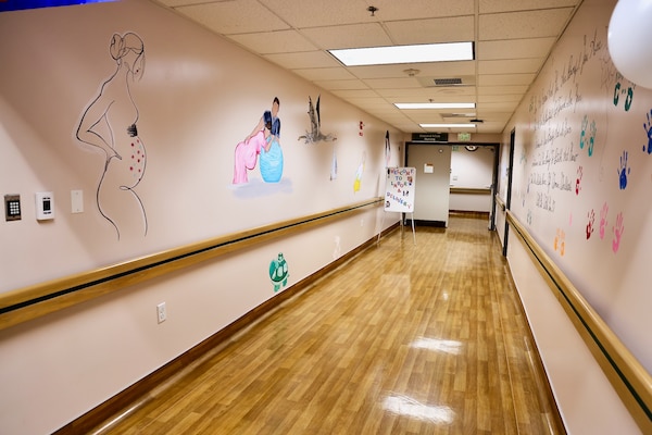 Murals and artwork painted by Hospitalman Lucia Carano add a meaningful and artistic touch to the revitalized Multi-Service Ward at Naval Hospital Twentynine Palms, which officially reopened during a ribbon-cutting ceremony on May 29. The artwork, themed around pregnancy and parenthood, was created to foster a comforting and supportive atmosphere for patients (U.S. Navy photo by Christopher C. Jones, NHTP/NMRTC Twentynine Palms public affairs officer).