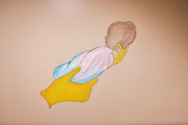 Murals and artwork painted by Hospitalman Lucia Carano add a meaningful and artistic touch to the revitalized Multi-Service Ward at Naval Hospital Twentynine Palms, which officially reopened during a ribbon-cutting ceremony on May 29. The artwork, themed around pregnancy and parenthood, was created to foster a comforting and supportive atmosphere for patients (U.S. Navy photo by Christopher C. Jones, NHTP/NMRTC Twentynine Palms public affairs officer).