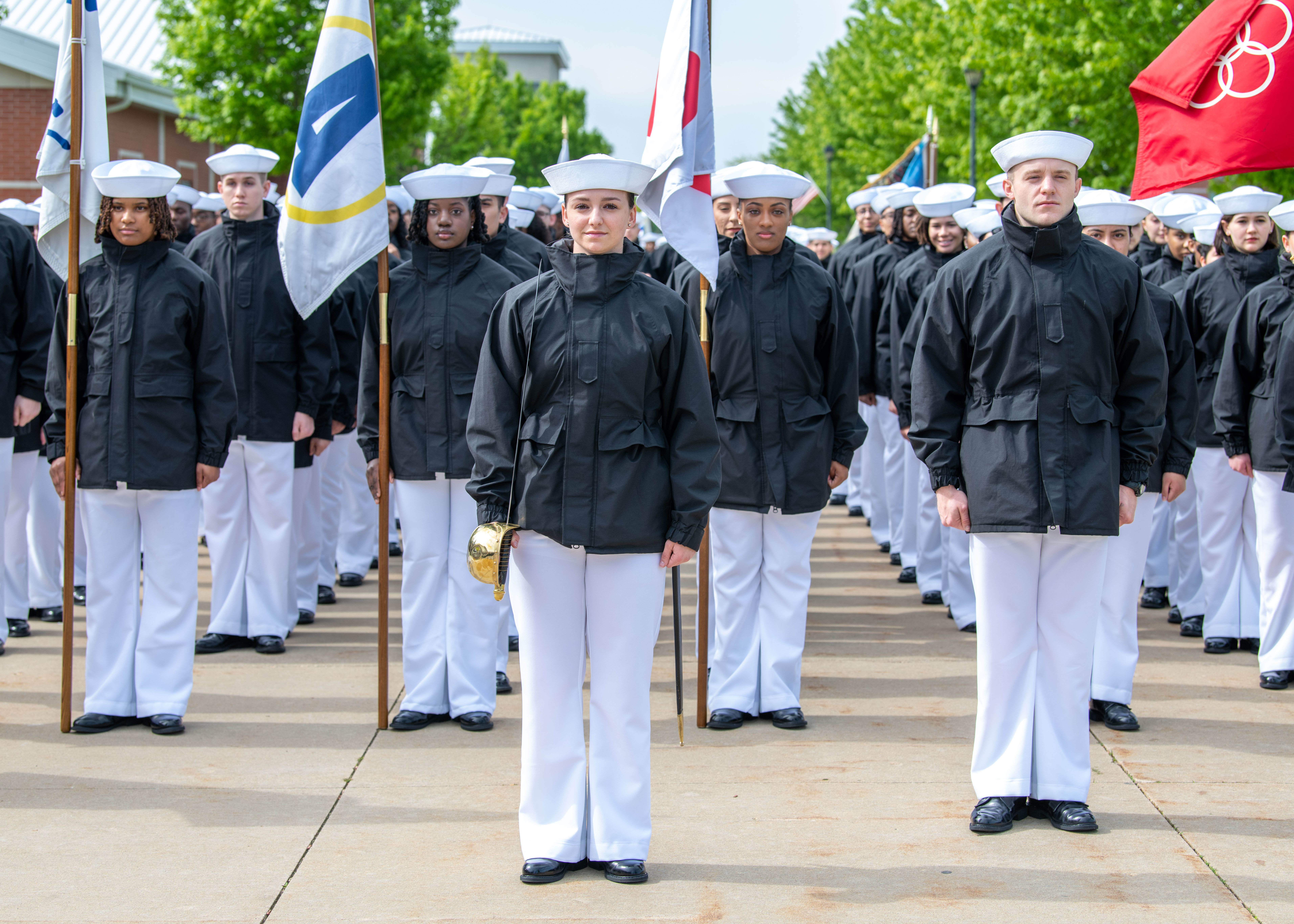 Sailors stand in formation before their Pass-in-Review ceremony at U.S. Navy Recruit Training Command in Midway Ceremonial Drill Hall. More than 40,000 recruits train annually at the Navy's only boot camp.