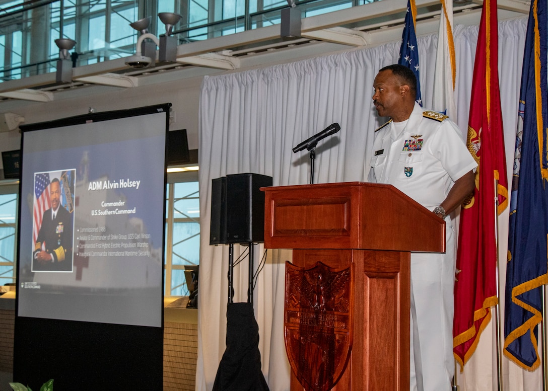 Admiral Alvin Holsey gives remarks before a podium