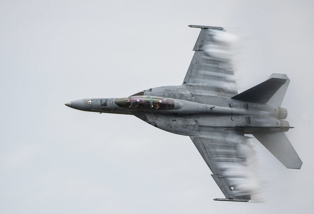 An F/A-18F Super Hornet, part of the United States Navy's Rhino Demo Team, performs at the Defenders of Freedom Air and Space Show at Offutt Air Force Base.