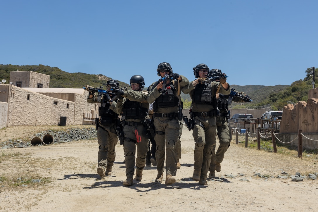 U.S. Marine Corps Special Reaction Team with the Provost Marshal's Office extract a high value target during Semper Durus 2025 at Marine Corps Base Camp Pendleton, California, May 21, 2025. Semper Durus is an MCIWEST full-scale regional command training and interoperability exercise designed to enhance emergency preparedness and rapid response capabilities across multiple Marine Corps installations in the southwestern United States. (U.S. Marine Corps photo by Cpl. Noah Martinez)