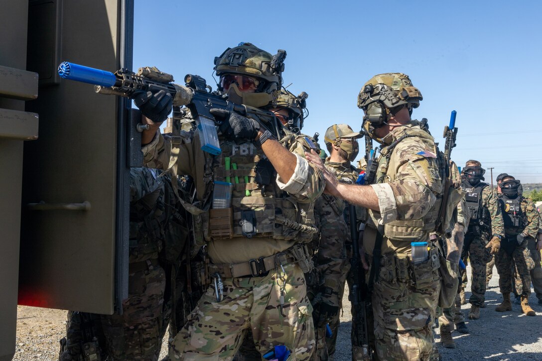 Special agents with the FBI’s San Diego and Los Angeles field offices post security as part of the exercise Semper Durus 2025 at Marine Corps Base Camp Pendleton, California, May 21, 2025. Semper Durus is an MCIWEST full-scale regional command training and interoperability exercise designed to enhance emergency preparedness and rapid response capabilities across multiple Marine Corps installations in the southwestern United States. (U.S. Marine Corps photo by Cpl. Noah Martinez)