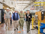 Felicienne Griffin, superintendent, Shop 31, Inside Machinist, leads Secretary of the Navy John Phelan and Capt. JD Crinklaw, commander, Puget Sound Naval Shipyard & Intermediate Maintenance Facility, on a tour of Building 431, May 28, 2025, in Bremerton, Washington. (U.S. Navy photo by Wendy Hallmark)