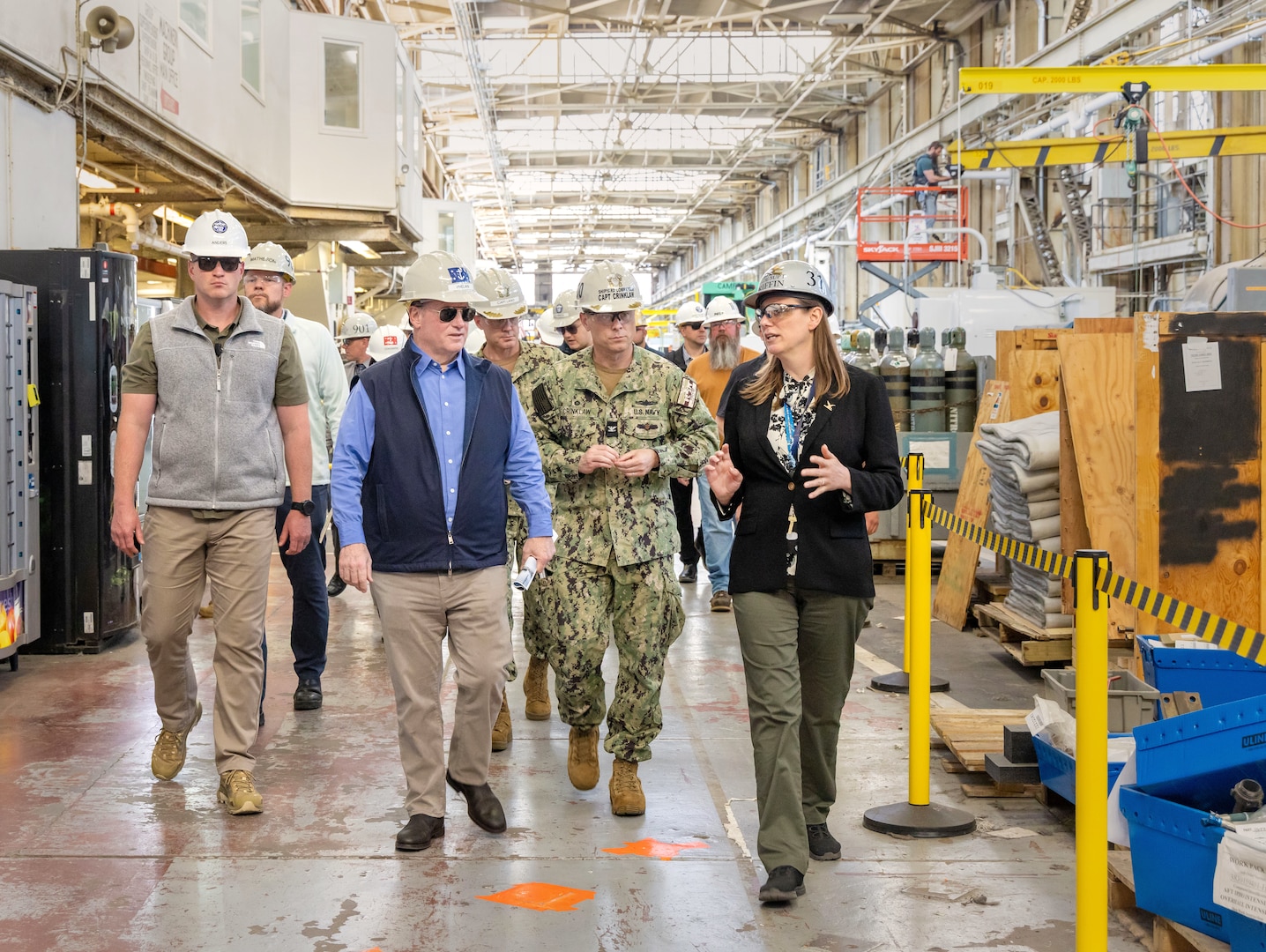 Felicienne Griffin, superintendent, Shop 31, Inside Machinist, leads Secretary of the Navy John Phelan and Capt. JD Crinklaw, commander, Puget Sound Naval Shipyard & Intermediate Maintenance Facility, on a tour of Building 431, May 28, 2025, in Bremerton, Washington. (U.S. Navy photo by Wendy Hallmark)