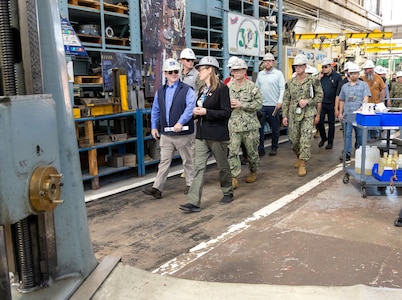 Secretary of the Navy John C. Phelan tours building 431, with Capt. JD Crinklaw, commander, Puget Sound Naval Shipyard & Intermediate Maintenance Facility and Felicienne Griffin, superintendent, Shop 31, Inside Machinists, leading, during a visit to PSNS & IMF May 28, 2025, in Bremerton, Washington. (U.S. Navy photo by Wendy Hallmark)
