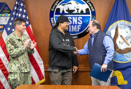 Secretary of the Navy John C. Phelan presents the Navy Superior Civilian Medal for Valor to Mario Arsenio Jr., shipfitter, Shop 11/17, Shipfitters, May 28, 2025, during Phelan’s visit to Puget Sound Naval Shipyard & Intermediate Maintenance Facility in Bremerton, Washington. (U.S. Navy photo by Wendy Hallmark)