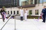 U.S. Navy Capt. Melissa Austin, Director of Walter Reed National Military Medical Center, and Dr. Stephen Ferrara, Acting Assistant Secretary of Defense for Health Affairs, cut the ribbon at the Roosevelt Pavilion Opening Ceremony at Walter Reed, Bethesda, Md., June 3. The new 530,000 square foot, state-of-the-art facility enhances Walter Reed’s ability to provide advanced, patient-centered care for service members and their families. (DOD photo by Roan Smith)
