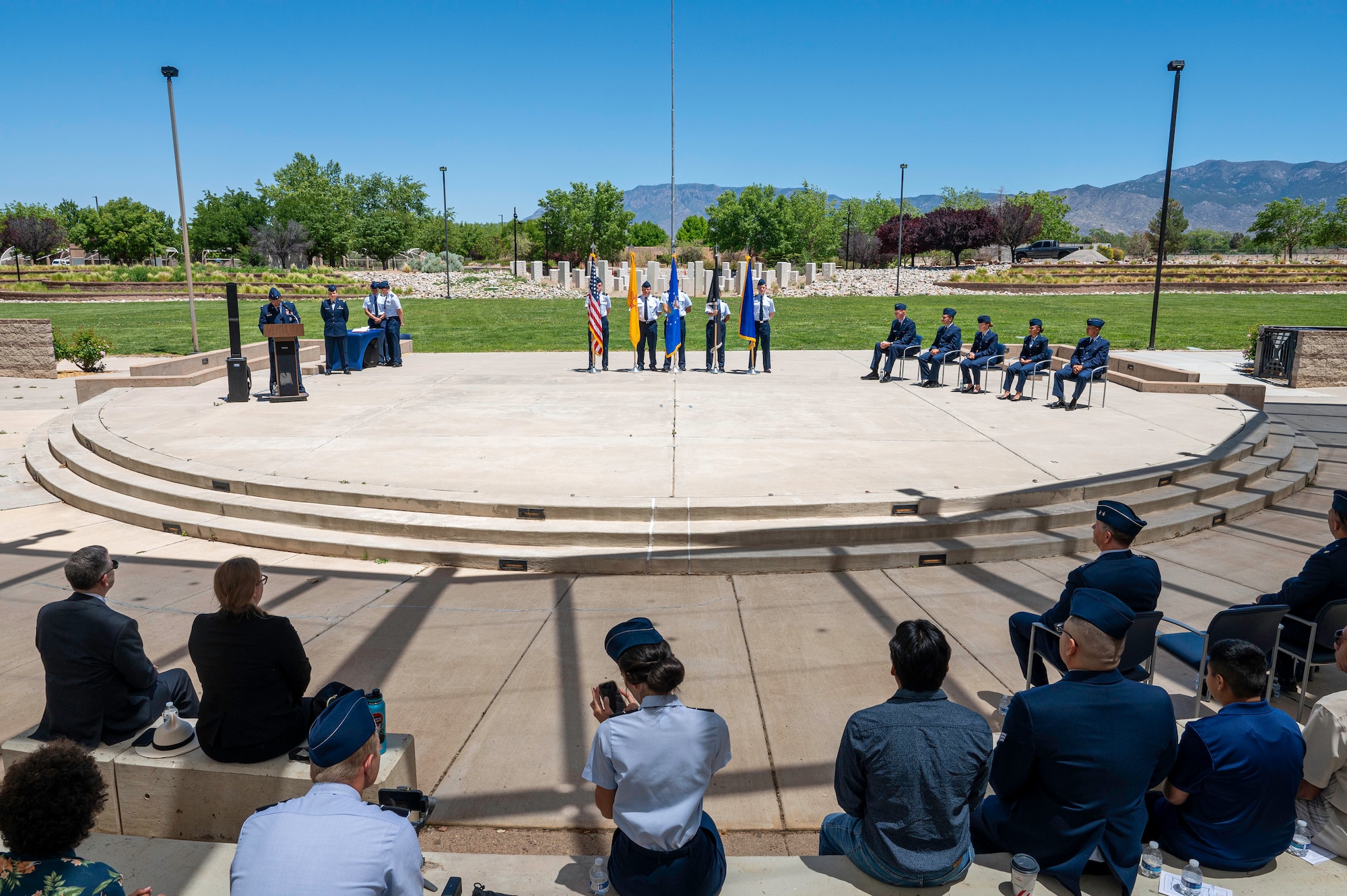 Servicemembers at podium in blues uniform