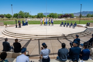 Servicemembers at podium in blues uniform