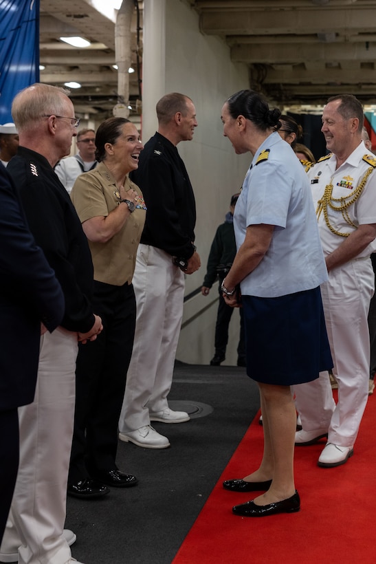 U.S. Marine Corps Lt. Gen. Bobbi Shea, middle left, commanding general, Fleet Marine Force, Atlantic, commander, Marine Forces Command, commander, Marine Forces Northern Command, greets U.S. Coast Guard Capt. Doreen McCarthy, middle right, deputy commander, Sector New York, during the U.S. Navy Reception aboard the San-Antonio Class amphibious transport dock USS New York (LPD 21) in New York, May 21, 2025. America’s warfighting Navy and Marine Corps celebrate 250 years of protecting American prosperity and freedom. Fleet Week New York 2025 honors the Navy, Marine Corps, and Coast Guard’s enduring role on, under, and above the seas. (U.S. Marine Corps photo by Lance Cpl. Yolanda Lightfoot)