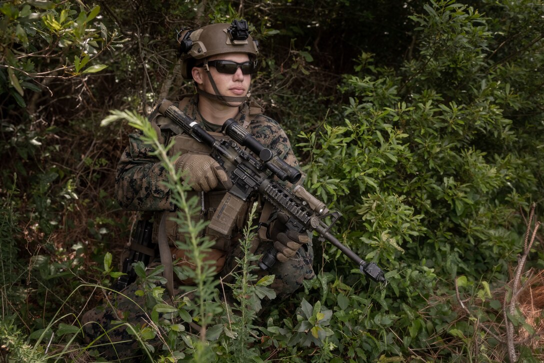 U.S. Marine Corps Lance Cpl. Corbin West, a rifleman with Lima Company, Battalion Landing Team 3/6, 22nd Marine Expeditionary Unit, sets security during an amphibious assault as part of Iwo Jima Amphibious Ready Group Marine Expeditionary Unit exercise, on Marine Corps Base Camp Lejeune, North Carolina, May 29, 2025. During ARGMEUEX, the 22nd MEU, aboard IWOARG shipping, conducts training in support of various mission essential tasks that enhance operational readiness and lethality as a unified IWOARG/22 MEU team. (U.S. Marine Corps photo by Sgt. Nathan Mitchell)