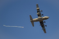 A KC-130J Super Hercules from Marine Corps Air Station Cherry Point, North Carolina, drops flares to counter surface to air missiles in a training exercise at Bollen Air-to-Ground Range located at Fort Indiantown Gap, Annville, Pennsylvania, April 17, 2025. Bollen Range is operated by the 193rd Special Operations Wing and supports training activities for a variety of aircraft from U.S. Air Force units as well as additional military helicopter, heavy transport and special mission aircraft conducting training in the northeastern United States. (U.S. Air National Guard photo by Airman Austin Stern)