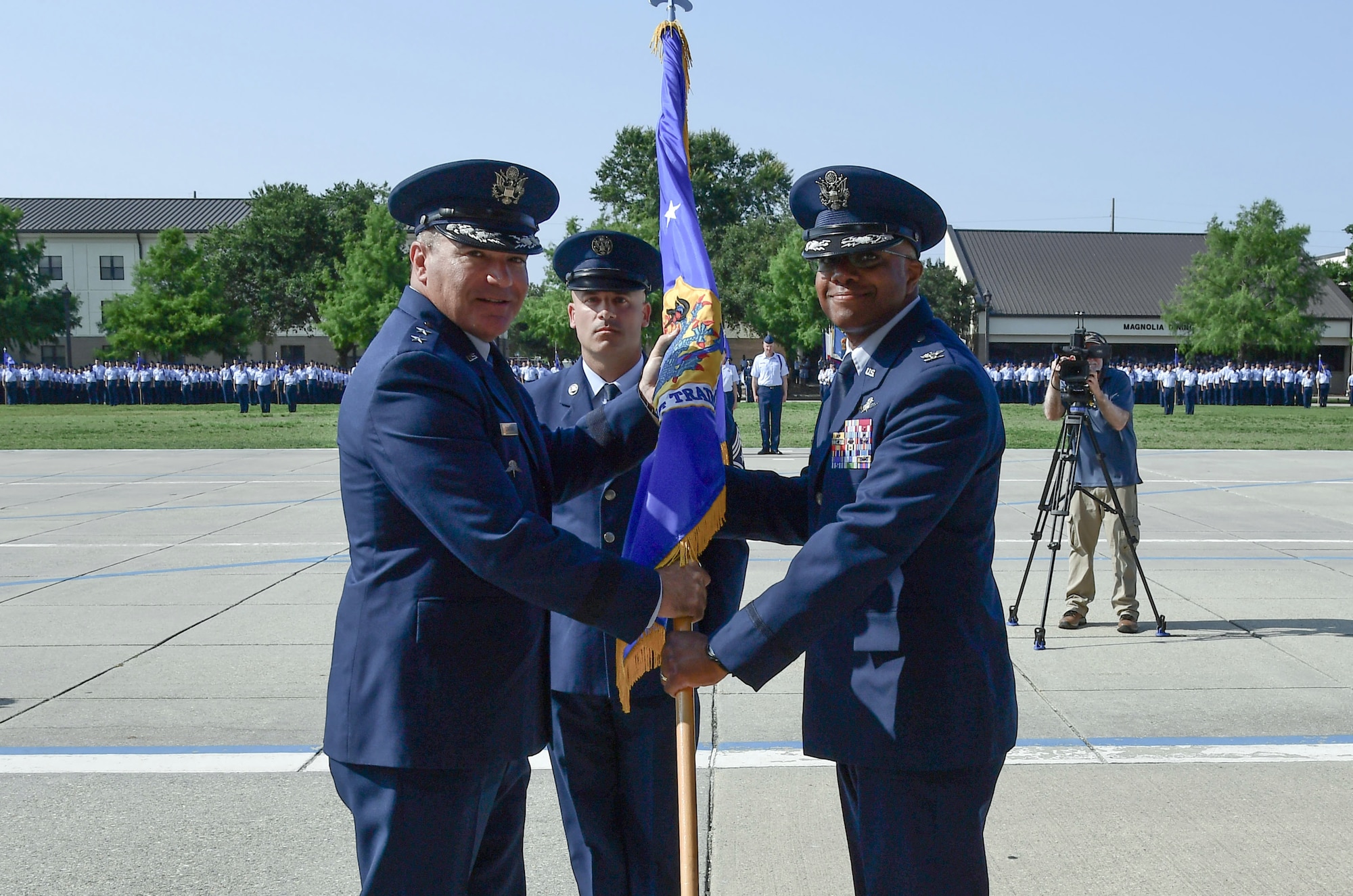 Airmen passing the guidon.