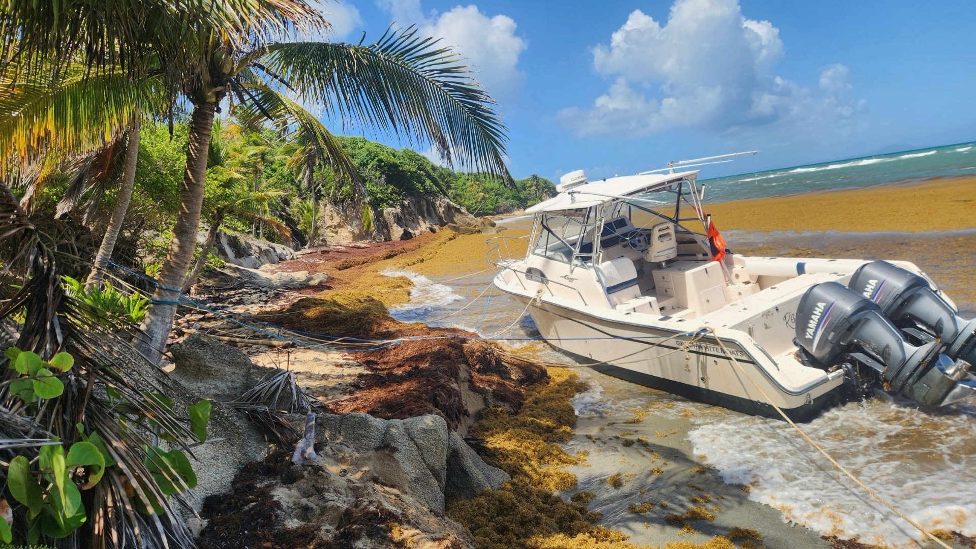 Coast Guard Sector San Juan Incident Management personnel are working in consultation with local and federal environmental agencies in overseeing efforts by specialized companies to remove a pollution threat from 30-foot vessel Red E or Not which grounded ashore with two people onboard on Icacos Beach in Yabucoa, Puerto Rico, June 2, 2025.  No injuries were reported in this case. (Courtesy photo)