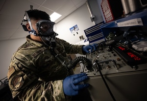 U.S. Airman Adrian M. Hernandez, 436th Operations Support Squadron Aircrew Flight Equipment apprentice, uses a scot tester on an aircrew oxygen mask at Dover Air Force Base, Delaware, June 3, 2025. The AFE team provides inspections and maintenance for flight safety equipment such as aircrew oxygen masks, parachutes, emergency escape slides and life rafts for the C-5M Super Galaxy and C-17 Globemaster III. (U.S. Air Force photo by Staff Sgt. Marco A. Gomez)
