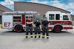 U.S. Air National Guard civilian firefighters, assigned to the Vermont Air National Guard Fire Department, pose in front of the fire truck that was the first on scene, South Burlington, VT, June 4, 2025. These firefighters provided the first fire truck on scene to a local fire.
