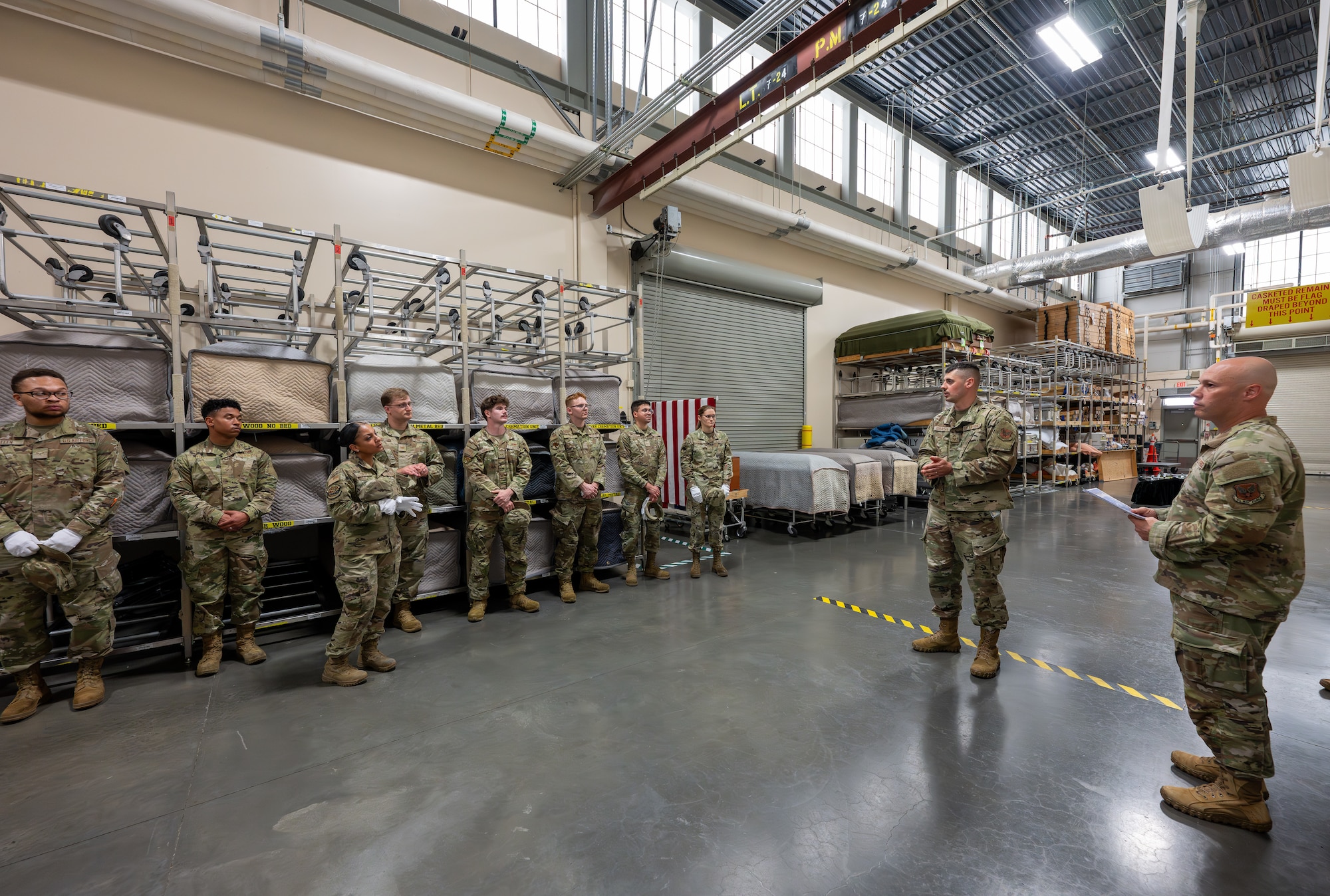 Senior Master Sgt. Vitaliy Gorbachyk, Air Force Mortuary Affairs Operations departures section chief, addresses Airmen with the 436th Mission Generation Group during their final evaluation for reverse dignified transfer training