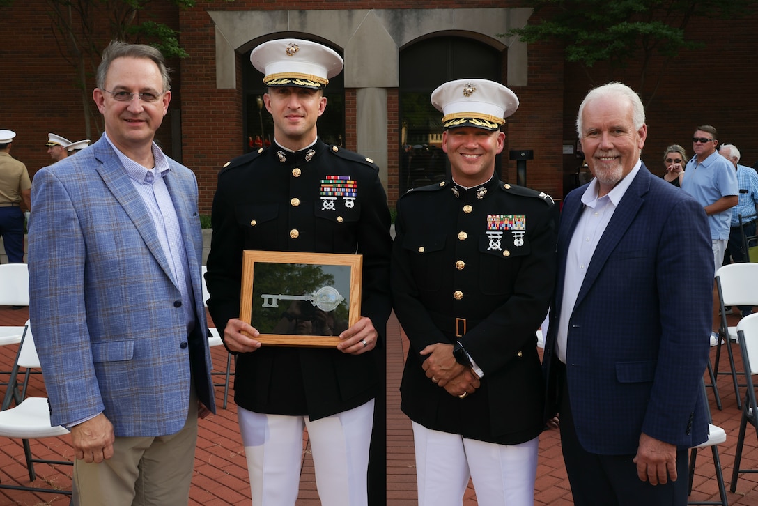 Austin Maxwell, councilmember for the city of Murfreesboro, left, U.S. Marine Corps Maj. Benjamin Sutphen, commanding officer of Recruiting Station Nashville, center-left, U.S. Marine Corps Col. Jimmy “J.J.” Wilson, Commanding Officer of Special Purpose Marine Air Ground Task Force-250, center-right, and Joe Carr, Rutherford county mayor, celebrate Marine Week Nashville at Civic Plaza in Murfreesboro, Tn., June 3, 2025. During Marine Week Nashville, Marines with Marine Corps Recruiting Command interacted with local high schools and businesses and supported sporting events, ceremonies and performances from the Silent Drill Platoon and the 2nd Marine Aircraft Wing Band. The Marine Corps is celebrating its 250th birthday with six multi-day Marine Corps community events, called Marine Weeks, in six major cities across the country. Marine Weeks will include activations across each host city featuring aircraft, equipment, recruiting opportunities, and public engagements. (U.S. Marine Corps photo by Lance Cpl. Brenna Ritchie)