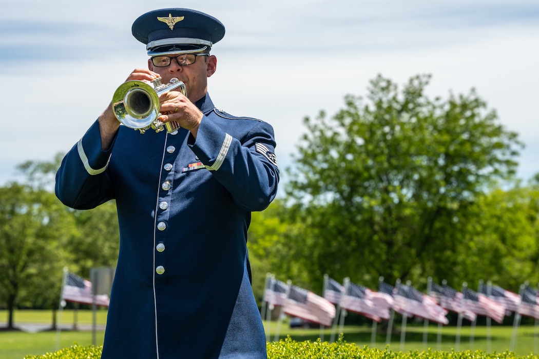 A trumpet player in blue service dress uniform