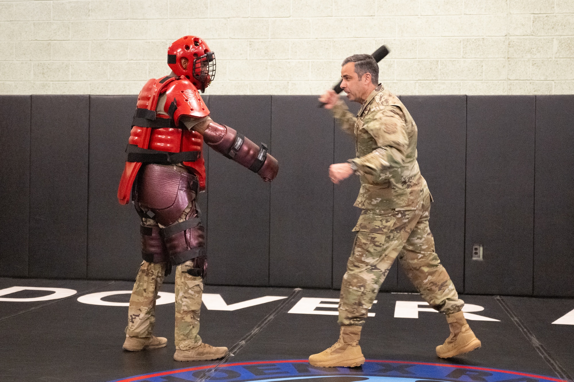 U.S. Air Force Col. Jamil Musa, right, 436th Airlift Wing commander, fends off a 436th Security Forces Squadron Phoenix Raven team member in a training suit during a command team immersion tour at Dover Air Force Base, Delaware, June 3, 2025. The new command team toured various units within the 436th Mission Support Group to familiarize themselves with their mission and capabilities. (U.S. Air Force photo by Mauricio Campino)