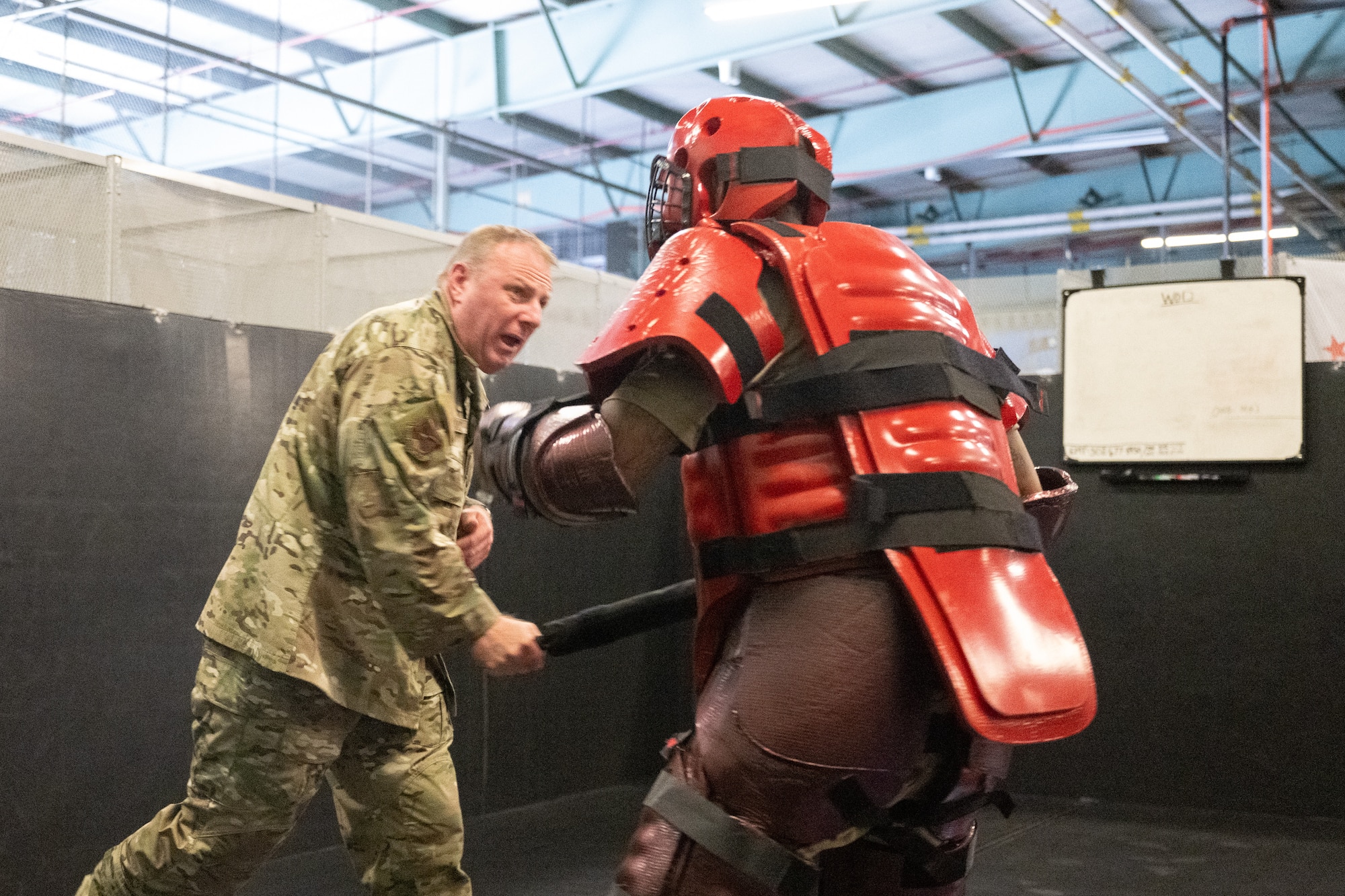 U.S. Air Force Chief Master Sgt. Elijah Edwards, 436th Airlift Wing command chief, fends off a 436th Security Forces Squadron Phoenix Raven team member in a training suit during a command team immersion tour at Dover Air Force Base, Delaware, June 3, 2025. The new command team toured various units within the 436th Mission Support Group to familiarize themselves with their mission and capabilities. (U.S. Air Force photo by Mauricio Campino)