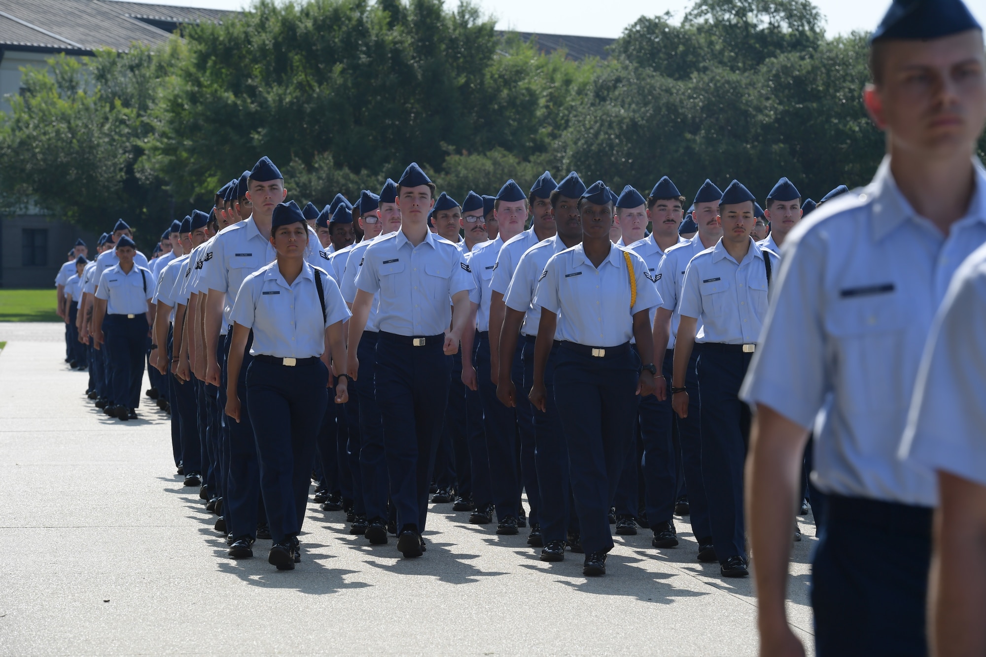 Airman marching in formation.