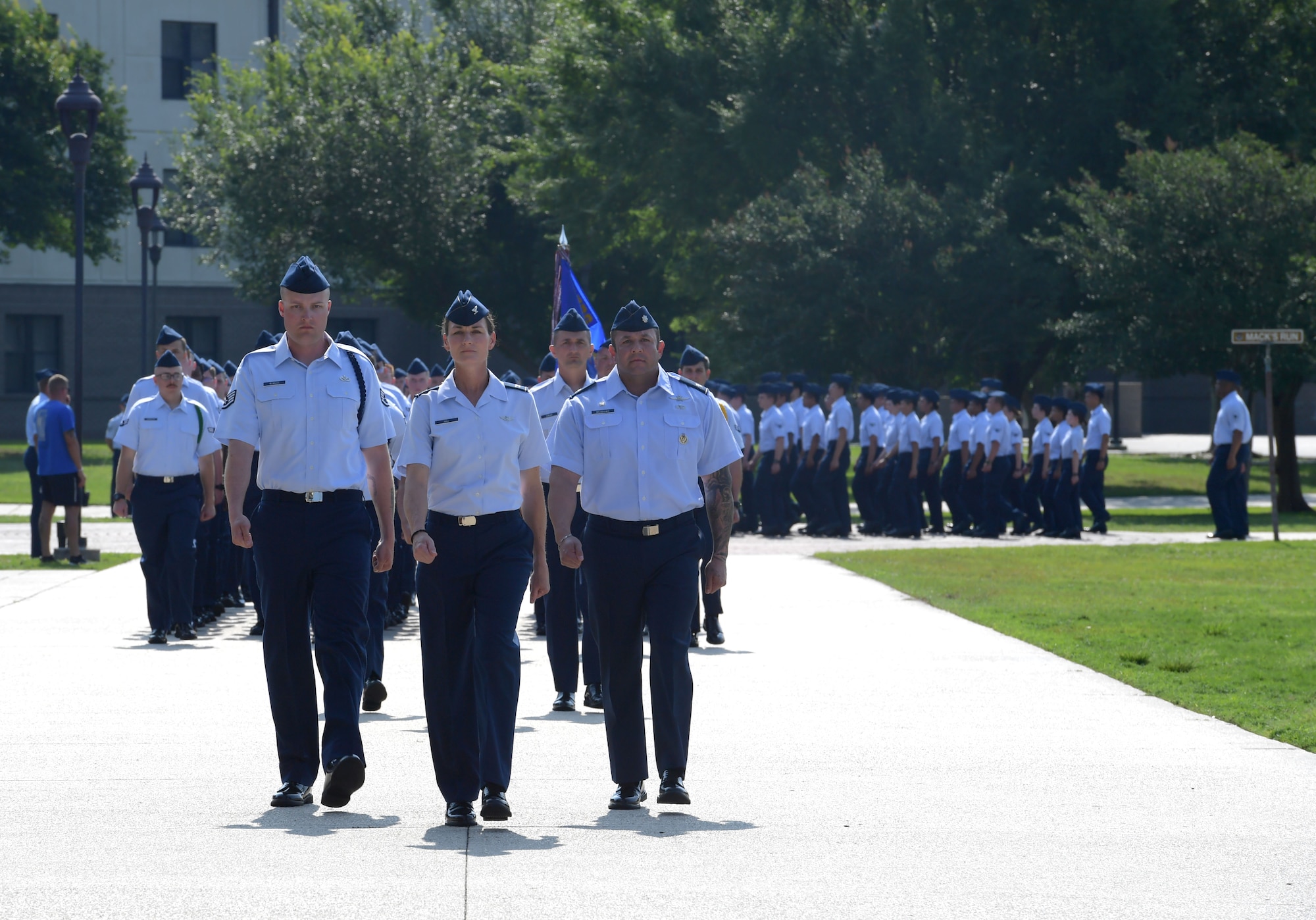 Airmen marching in formation.