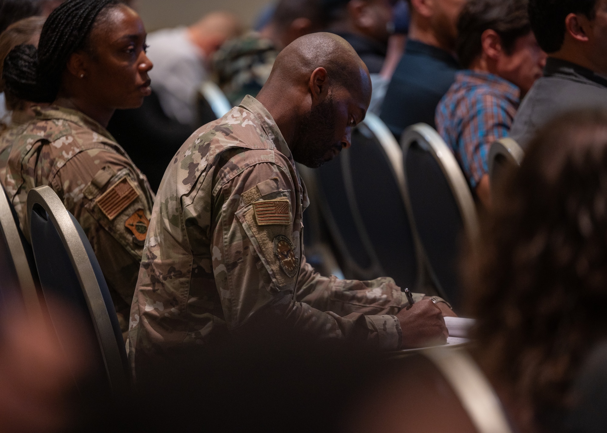 An attendee writes notes down during a commander’s call at Vandenberg Space Force Base, Calif., June 3, 2025. During the all-call, attendees listened as SLD 30 leadership highlighted accomplishments of the Delta over the course of the last two years, underscoring the importance of the execution of mission in line with strategic objectives laid out by the base commander, U.S. Space Force Col. Mark Shoemaker.