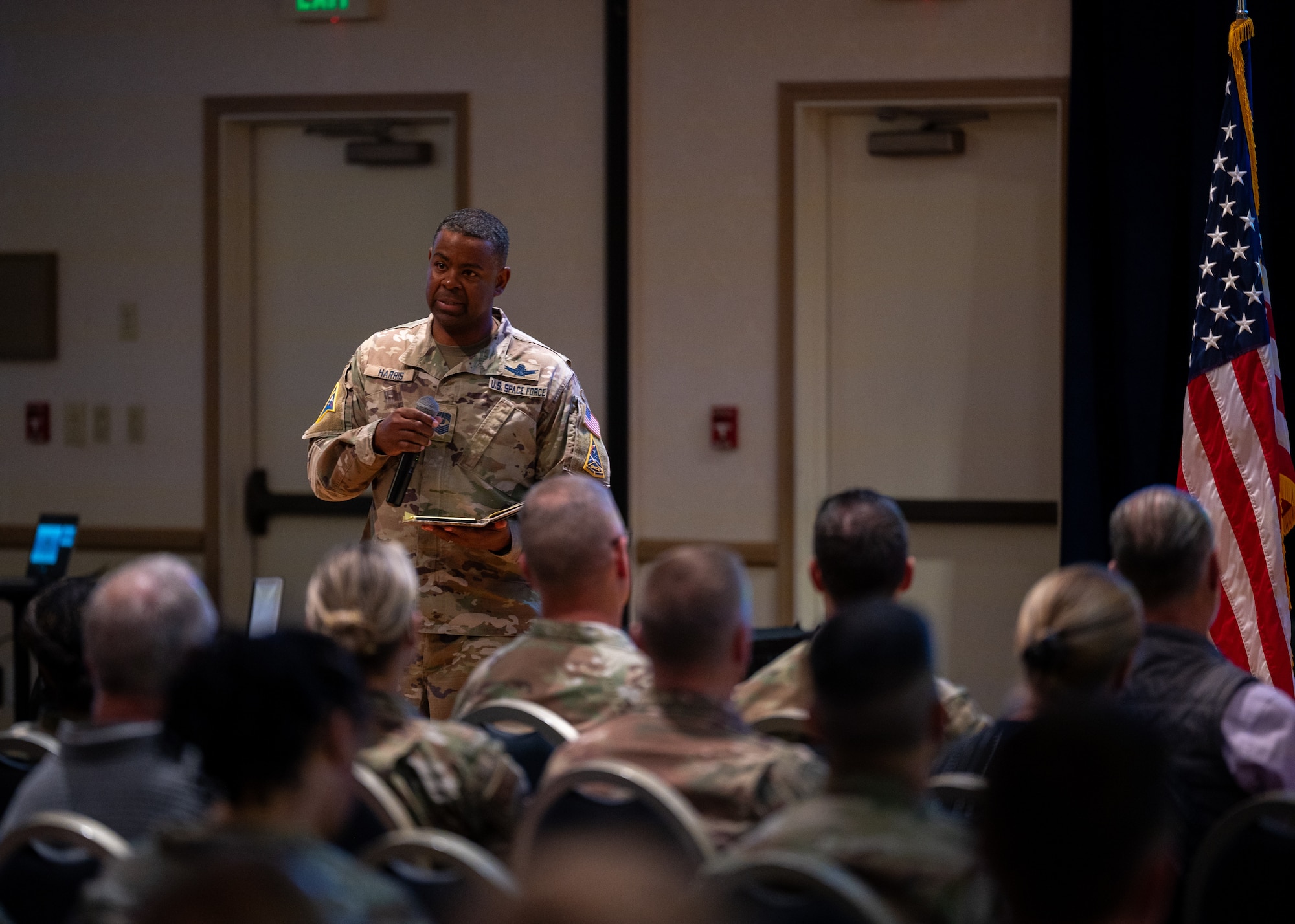 U.S. Space Force Chief Master Sgt. Jay Harris, Space Launch Delta 30 senior enlisted leader, addresses attendees of an all-call at Vandenberg Space Force Base, Calif., June 3, 2025. Harris spoke on the countless accomplishments of the Delta over the last two years, highlighting the creation of the base’s innovation center, the Crucible, along with improvements to the base’s gas station and overhauls to the Beachcomber’s dining facility.