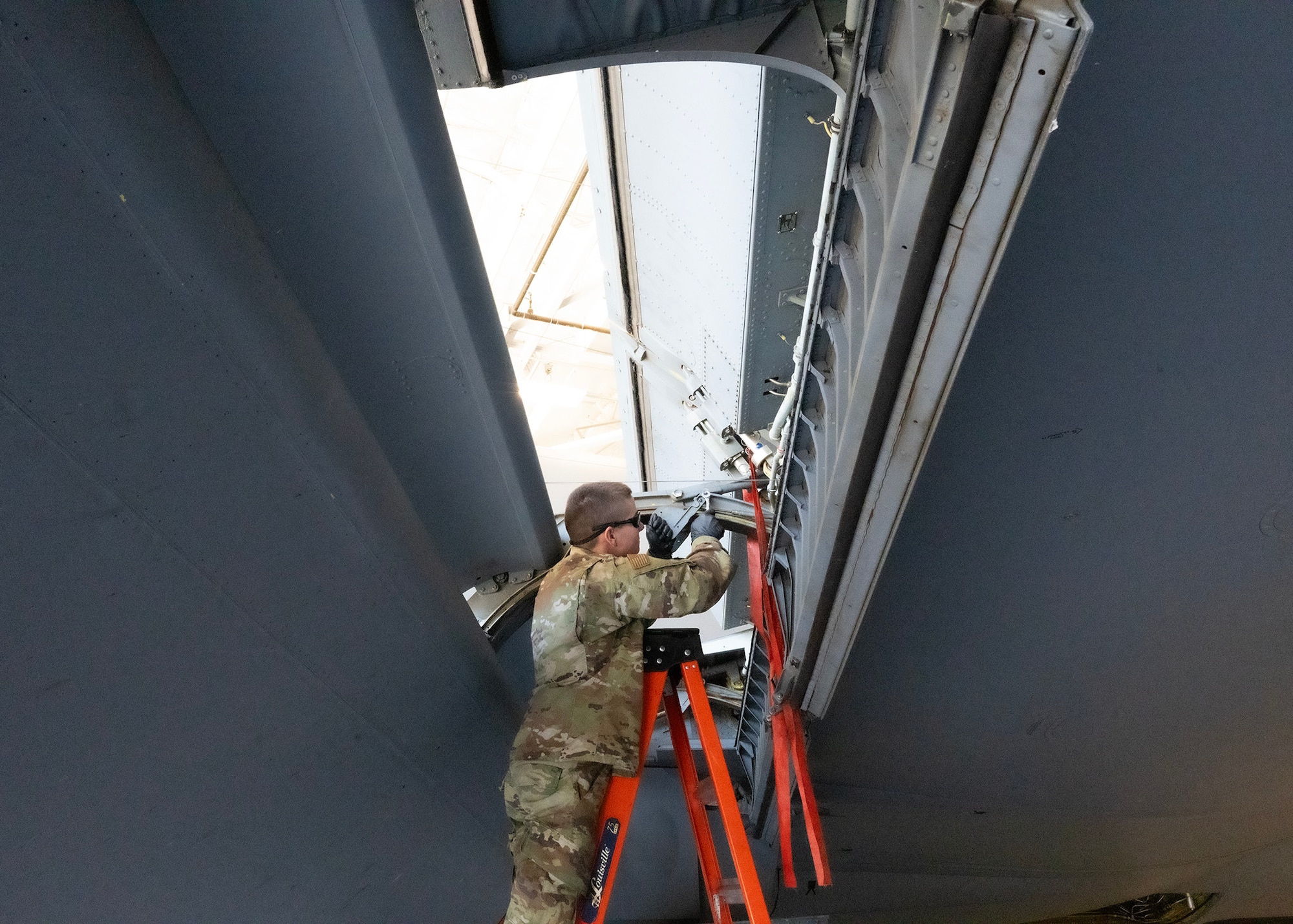 U.S. Air Force Airman Matthew Peters, 940th Air Refueling Wing Maintenance Squadron, conducts a cove lip door lap adjustment on a U.S. Air Force KC-135 Stratotanker, June 3, 2025.