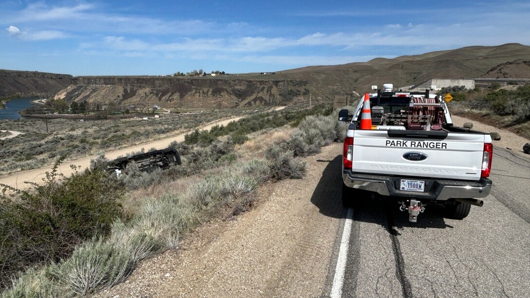 A USACE park ranger truck is parked alongside a road near Lucky Peak Dam.
