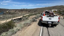 A USACE park ranger truck is parked alongside a road near Lucky Peak Dam.