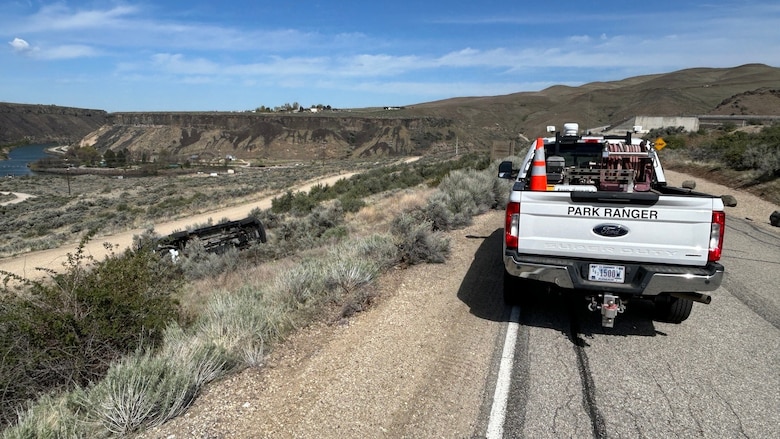 A USACE park ranger truck is parked alongside a road near Lucky Peak Dam.