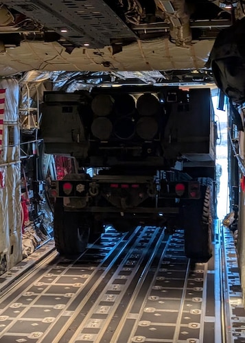 Heavy equipment load on C-130J for airdrop.