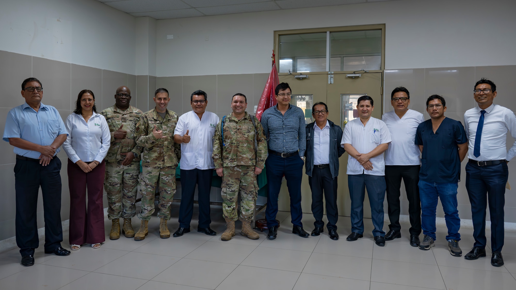 U.S. Air Force AMISTAD team members and Hospital Regional de Loreto leadership pose for a photo on the opening day of AMISTAD 2025 in Iquitos, Peru, June 2, 2025. This Peruvian and U.S. medical assistance training opportunity offers real-world benefits to U.S. and partner nation medical teams and the people of Peru by relieving strained medical systems, training U.S. and local medical professionals, and promoting the health and well-being of the people of Peru. (U.S. Air Force photo by Senior Airman Victoria Edwards)
