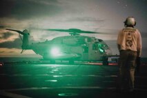A U.S. Marine Corps CH-53E Super Stallion attached to Marine Heavy Helicopter Squadron 466, Marine Aircraft Group 16, 3rd Marine Aircraft Wing, prepares to lift off the flight deck of the of the amphibious dock landing ship USS Harpers Ferry (LSD 49) during Quarterly Underway Amphibious Readiness Training 25.3 while underway in the Pacific Ocean, June 1, 2025.